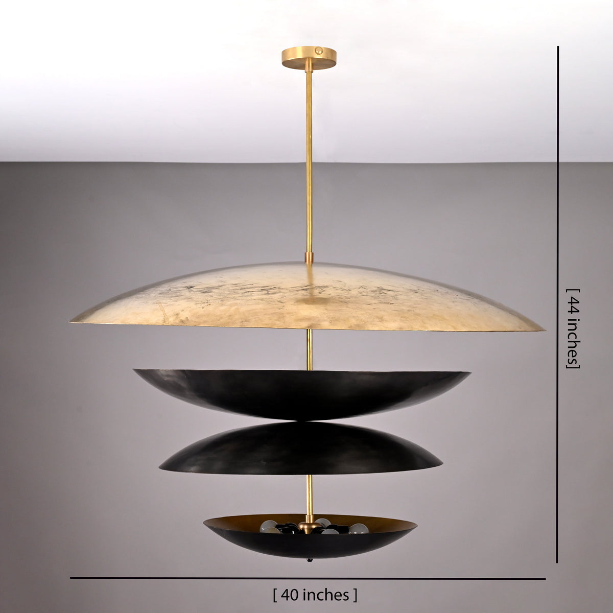 Dimension view of 10-light brass layered disc chandelier measuring 40 inches wide and 44 inches tall with sculptural tiered bowl design.