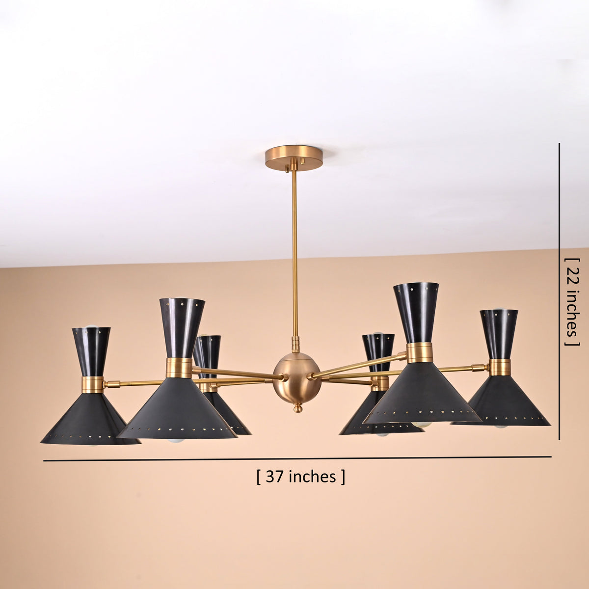 12-light mid-century brass and black chandelier showing 37-inch width and 22-inch height measurements with dual-cone perforated shades.