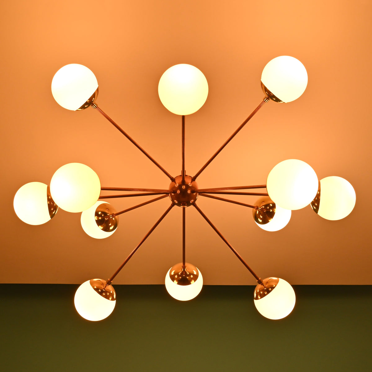 Ceiling mounted 12 opal glass brass chandelier with sputnik style arms and premium brass construction