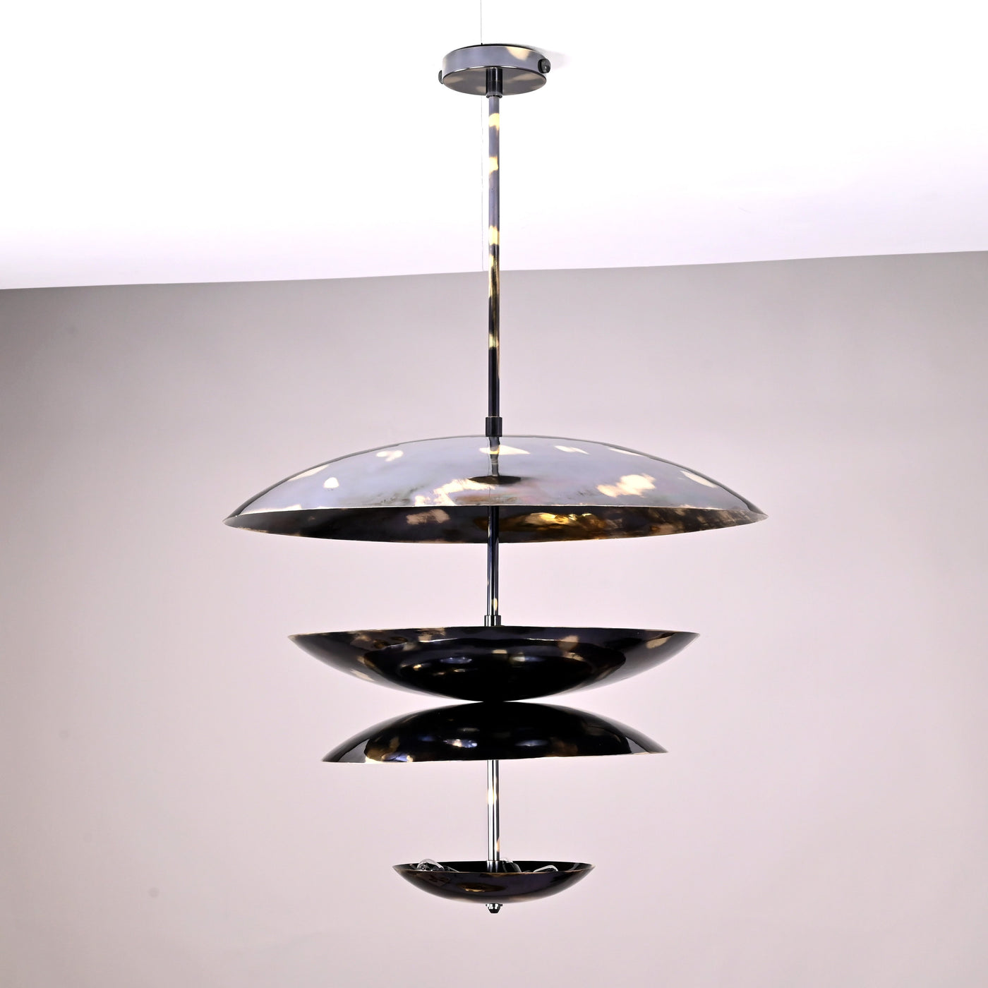24-inch multi-tier brass disc chandelier with sculptural layered design and polished finish