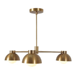 Front view of modern 3-light brushed brass chandelier featuring dome-shaped shades and central rod suspension in mid-century minimalist style.