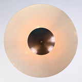 Bottom view of 3 light disc style brass chandelier highlighting bowl shade and soft diffused glow