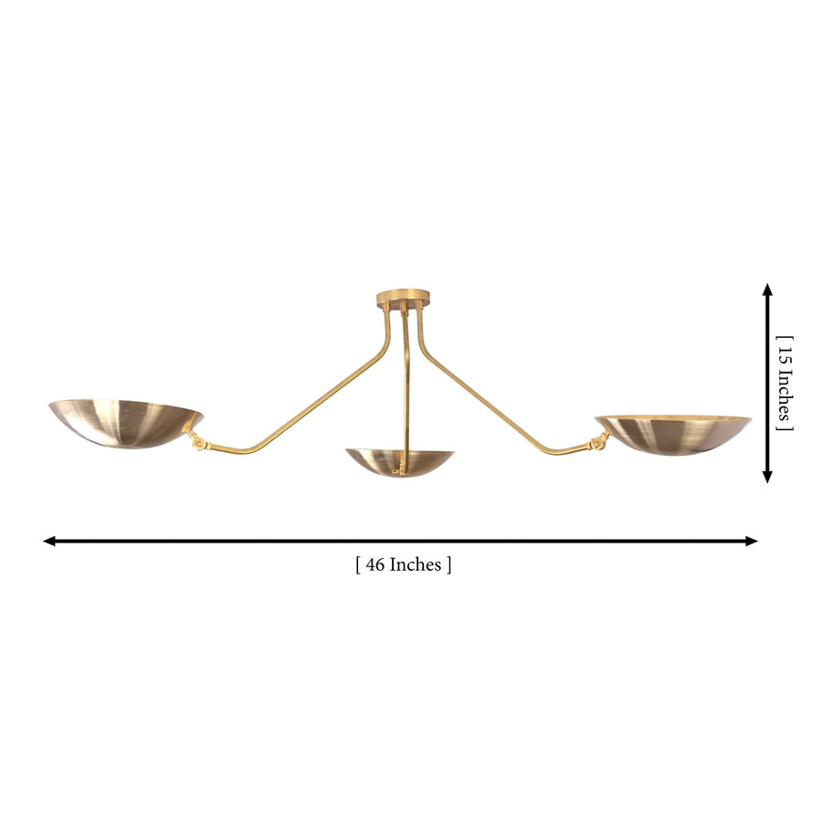 Verona Dish Trio Chandelier styled above dining table in a warm modern room with soft evening lighting.