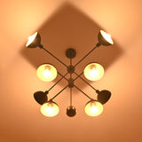 8-Light Brass Chandelier Top View – Geometric Black and Gold Pendant with Glowing Shades