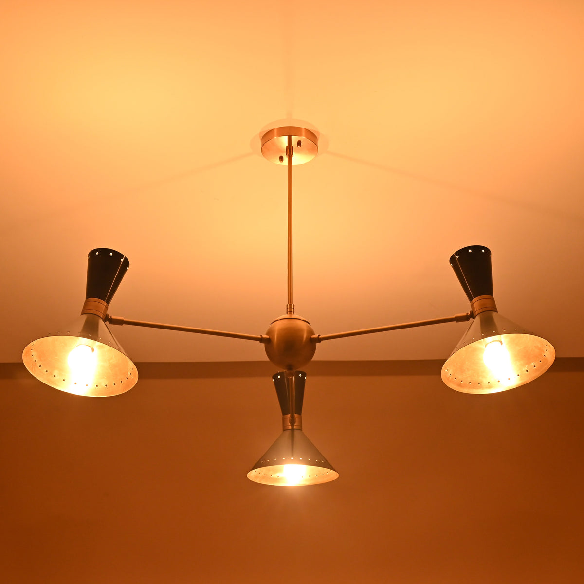 6-Light Cone Style Brass Chandelier – Overhead View with Glowing Perforated Shades