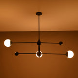 Warm-lit modern 3-light chandelier with linear matte black arms – horizontal view