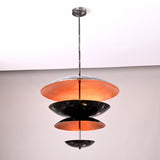 Three-tier bowl shade chandelier in blackened brass with warm uplighting