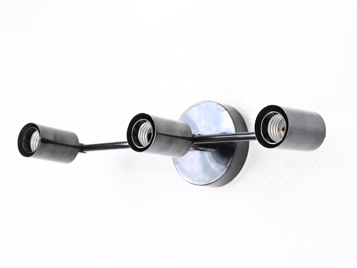 Berlin Axis exposed-bulb brass wall light detail