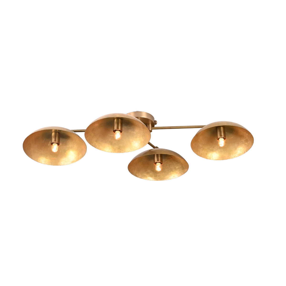 Angled view of 4 disc brass flush mount ceiling light showing layered bowl design and warm light diffusion