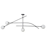 Close-up of 4-globe ceiling light with matte black brass structure and soft glowing opal globes