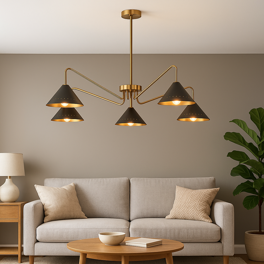 Front view of handcrafted 5-light brass chandelier featuring matte-black perforated cone shades and brushed brass arms.