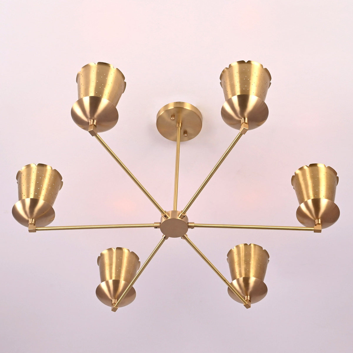 Bottom view of 6 light brass chandelier highlighting radial arm design and cone shades crafted from solid brass.