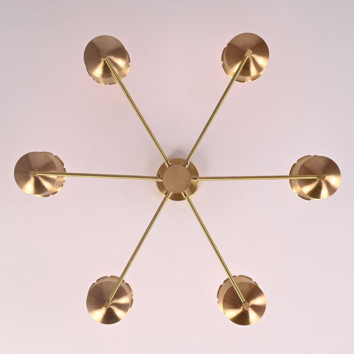 Top view of 6 light brass chandelier showing central canopy, balanced arm layout, and premium brushed brass construction.