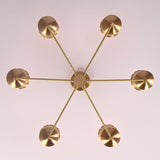 Top view of 6 light brass chandelier showing central canopy, balanced arm layout, and premium brushed brass construction.