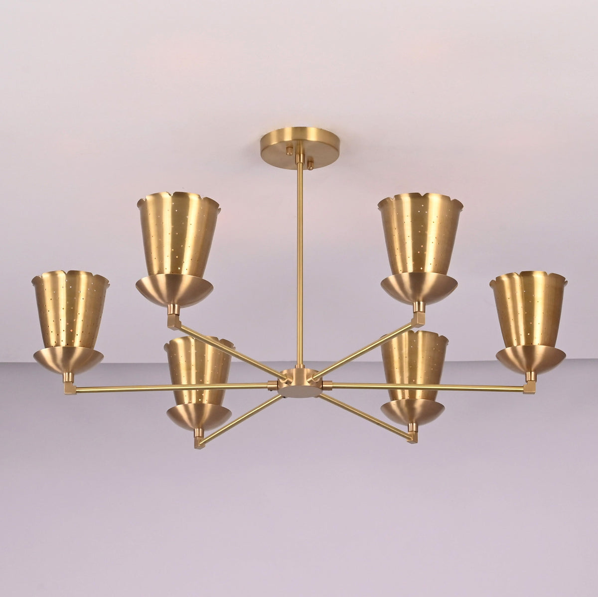 Angled view of handcrafted 6 light brass cone shade chandelier with symmetrical arms and minimalist industrial design.