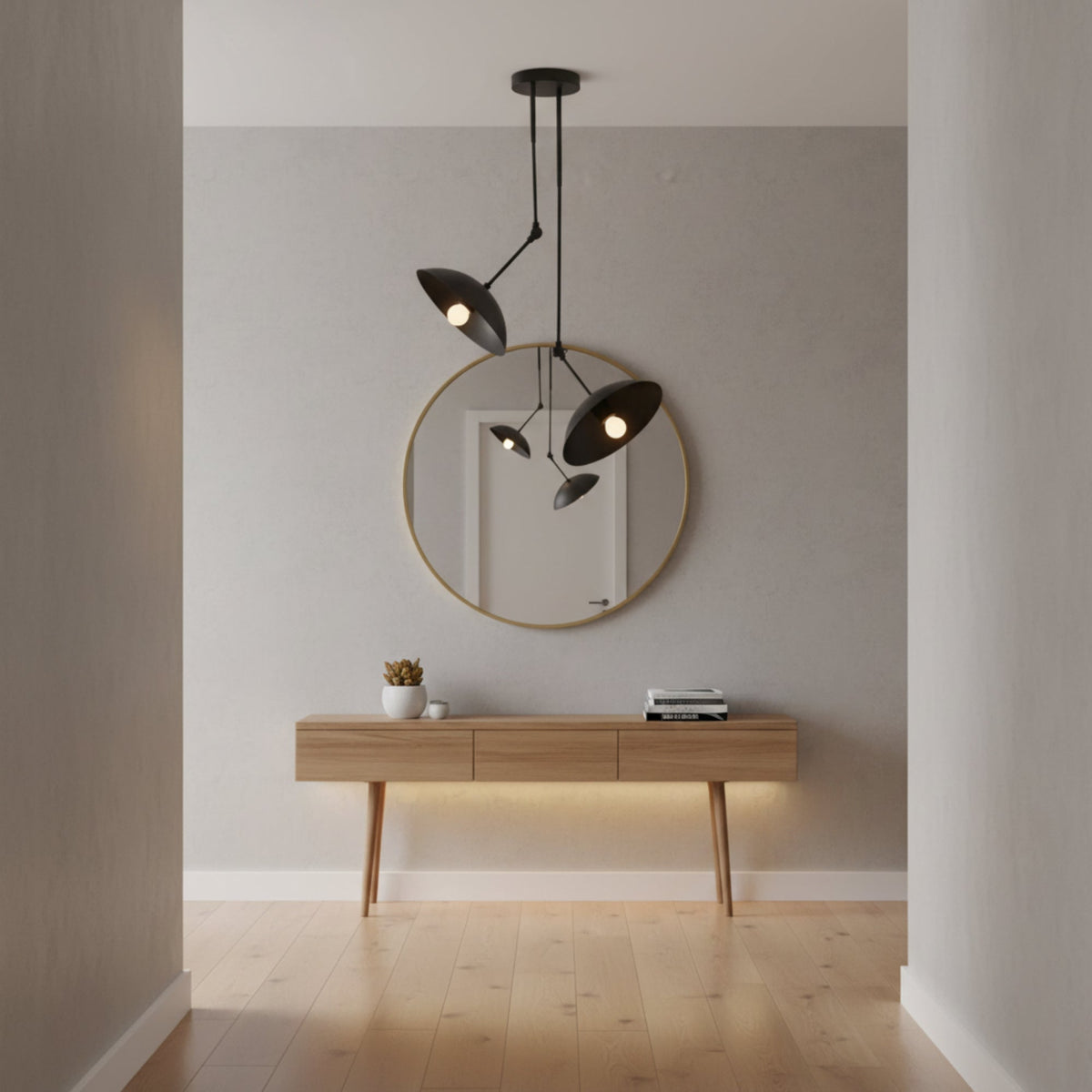 A modern black dual-light pendant ceiling fixture with two adjustable conical shades suspended from a round ceiling canopy on a plain white background.