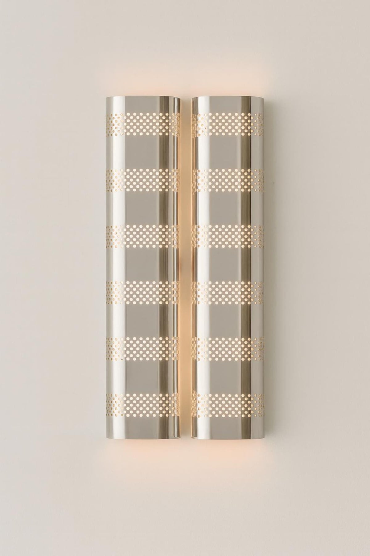Decorative wall sconce with geometric pattern on a light gray background