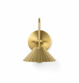 Brass wall sconce with a fluted design on a white background