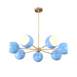 Angled view of modern 7 bowl brass chandelier with blue glass shades in mid century design