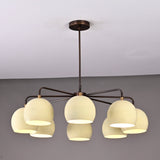 Front view of handcrafted 8-light brass chandelier with ivory bowl shades and bronze finish by Brass Leaf Studio.