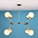 Side profile of an 8-light brass globe chandelier showing linear arm structure, opal glass shades, and black accent joints.
