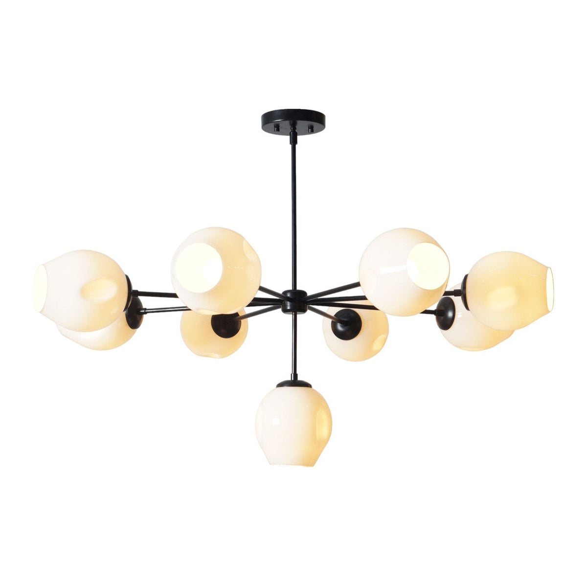 Illuminated 9-light brass chandelier with glowing white glass shades and sleek black brass structure