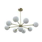 Solid brass Sputnik chandelier with nine frosted glass globes arranged in a radial multi-arm ceiling light design