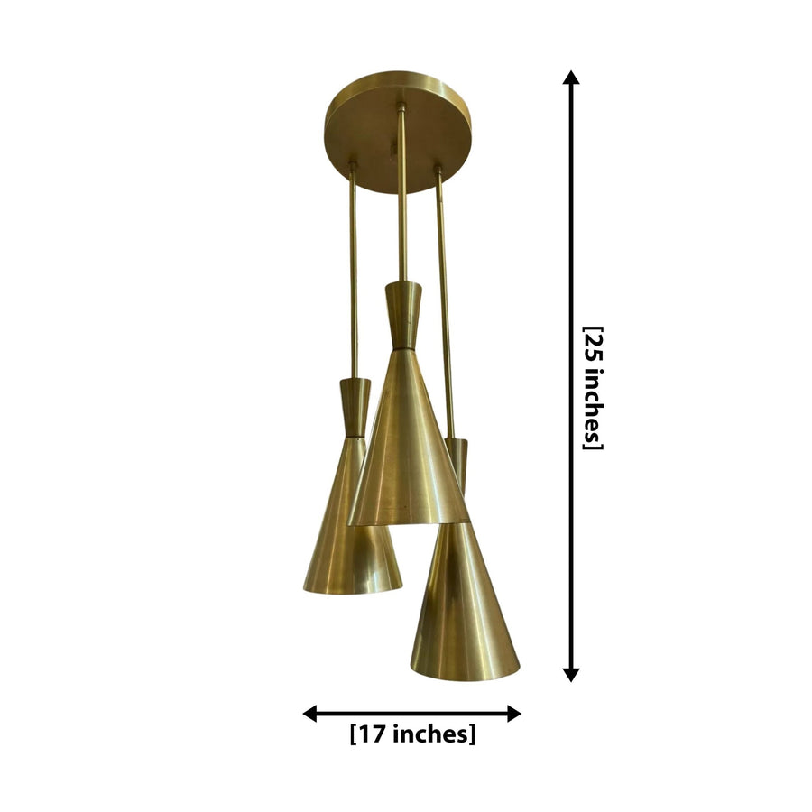 Adelaide 3 light brass-tone cluster chandelier shown from the front with elongated cone shades arranged at staggered heights.