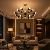 Alexandria 18 light black cone Sputnik chandelier illuminated in a modern living room with warm ambient lighting.