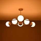 Side view of Aria Orbit Globe Chandelier with six illuminated globes and compact circular ceiling light profile.