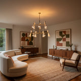 Auckland 24 light chandelier shown illuminated with white double-cone shades and a sculptural two-tier brass-tone frame.