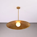 Angled view of Aurelia Globe Saucer Pendant Light showing broad saucer shade and slim ceiling rod.