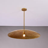 Aurelia Saucer Pendant Light with wide dome shade and single glowing bulb in front view.