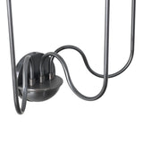 Close-up of the sconce’s rounded black metal base with three elegantly curved connecting arms showing refined craftsmanship and sturdy construction.