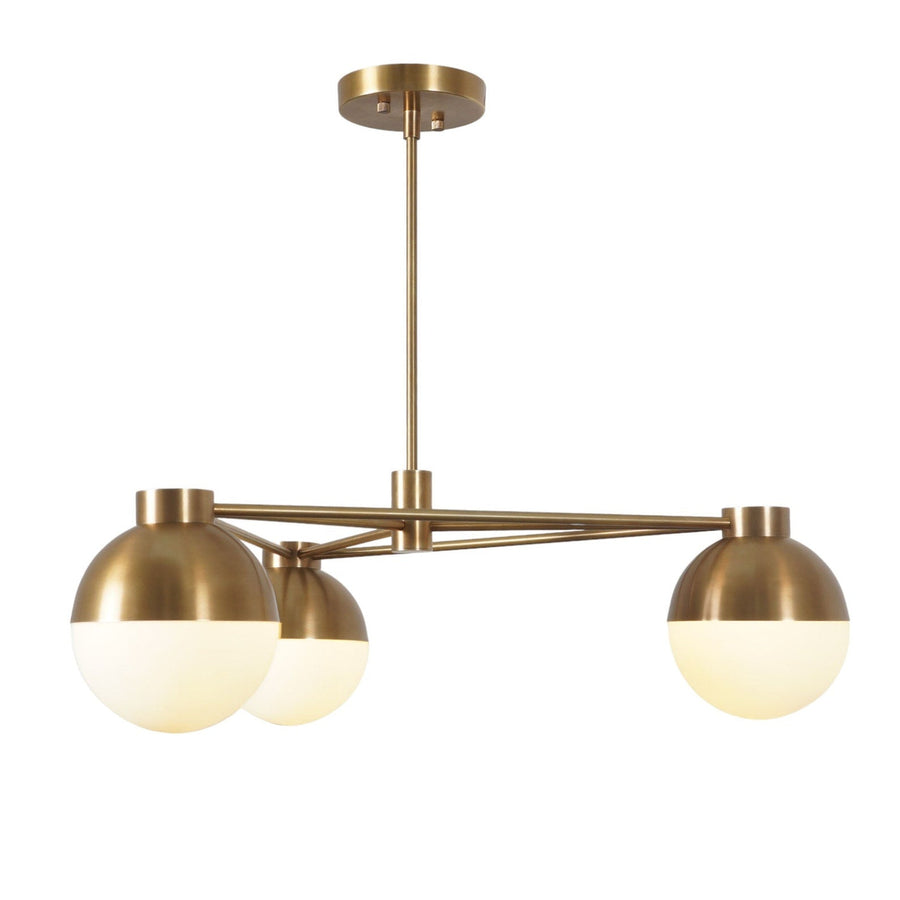 Modern 3-light brass chandelier with frosted glass globes and geometric brass frame, combining mid-century style with minimalist elegance.