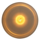 Underside view of modern black pendant light showing glowing bulb and golden interior for warm, inviting illumination.
