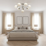 Como 8 light Mid-Century Modern Sputnik chandelier featuring opal glass globes and polished silver-tone radial arms.
