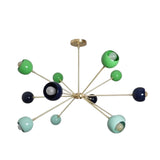 Crete 12 light multicolor Sputnik chandelier shown from an angled view featuring asymmetrical brass-tone arms and colorful spherical shades.