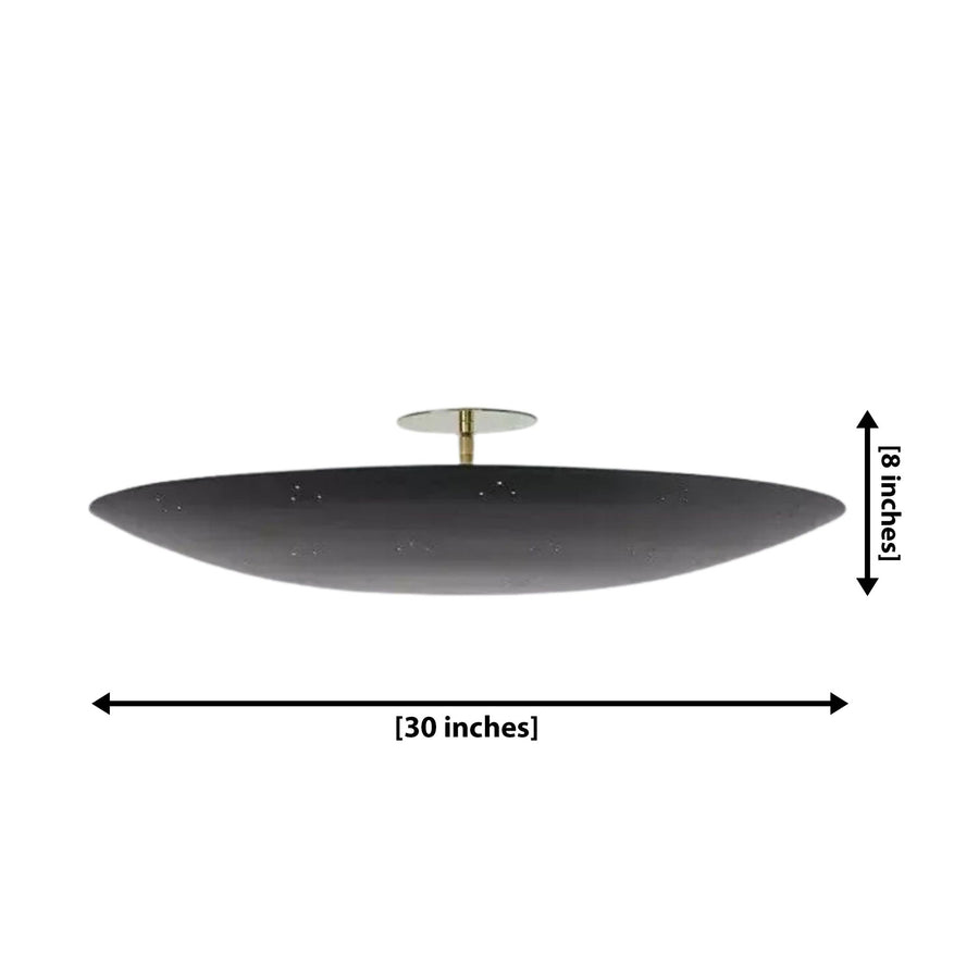 Denver 5 light black sculptural disc chandelier illuminated on the ceiling of a warm contemporary bedroom with soft ambient lighting.
