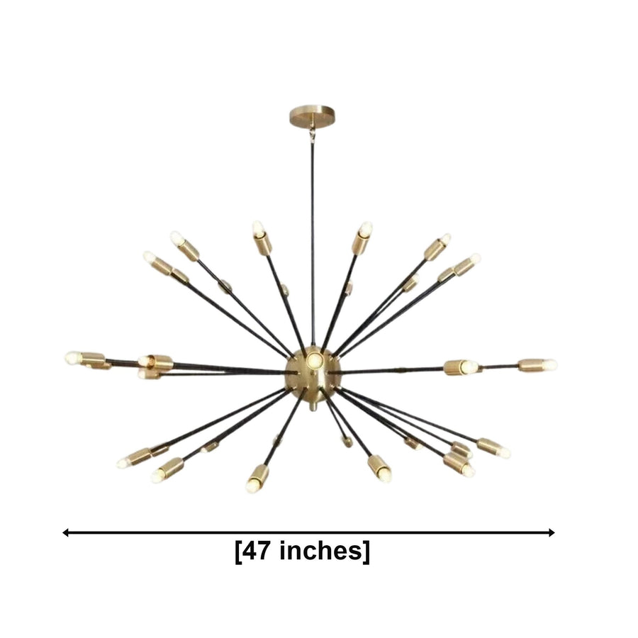 Dublin 32 light black and brass Sputnik chandelier illuminated above a dining table in a warm Mid-Century Modern interior.