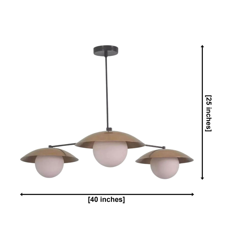 Eclipse 3 light disc globe chandelier illuminated above a wooden dining table in a modern warm-toned dining room