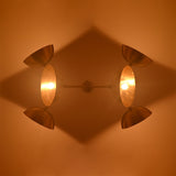 Florence Disc Orbital Chandelier ceiling view with four glowing disc shades and warm ambient light effect.