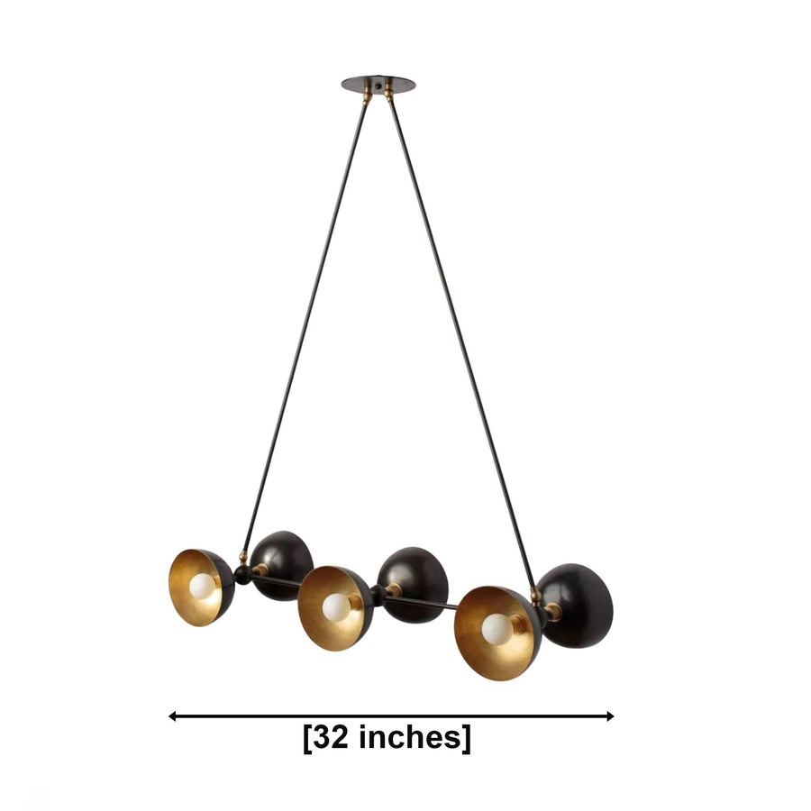 Modern multi-light chandelier with four black spherical shades and four brushed gold conical reflectors, suspended by black cords from a round ceiling canopy on a white background.