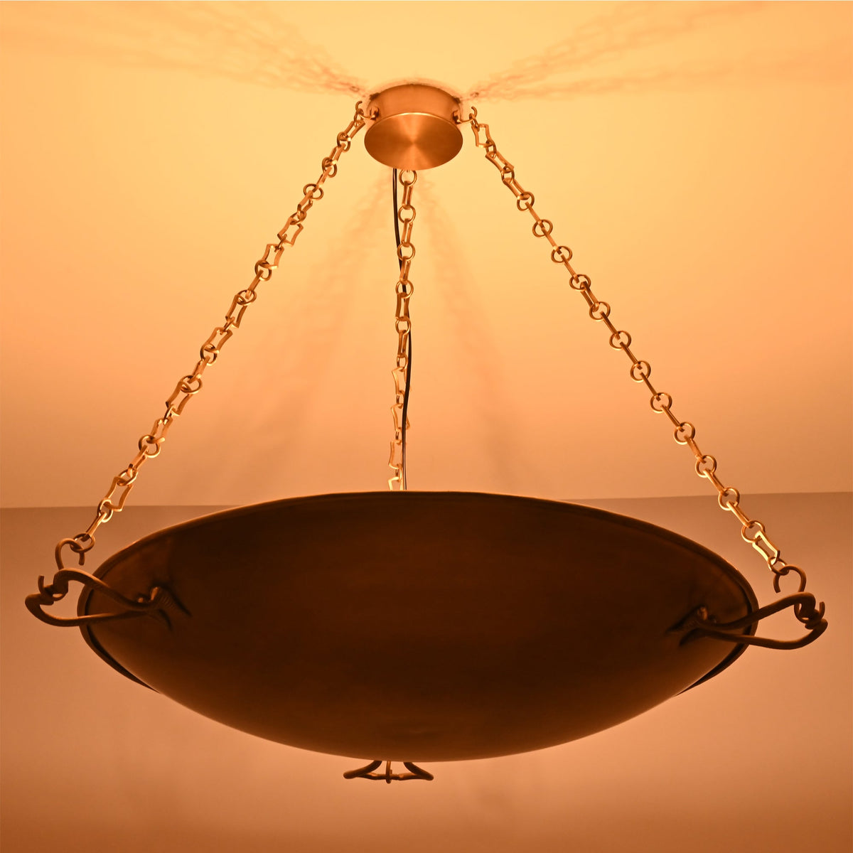Warm ambient lighting view of the Hudson Artisan Bowl Chandelier creating soft indirect ceiling illumination with an elegant suspended bowl.