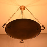 Illuminated underside of the Hudson Artisan Bowl Chandelier highlighting the handcrafted bowl and soft upward ambient lighting.