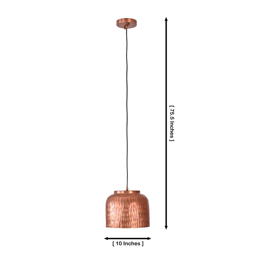Hudson hammered copper dome pendant light installed above a dining table in a warm modern dining room interior