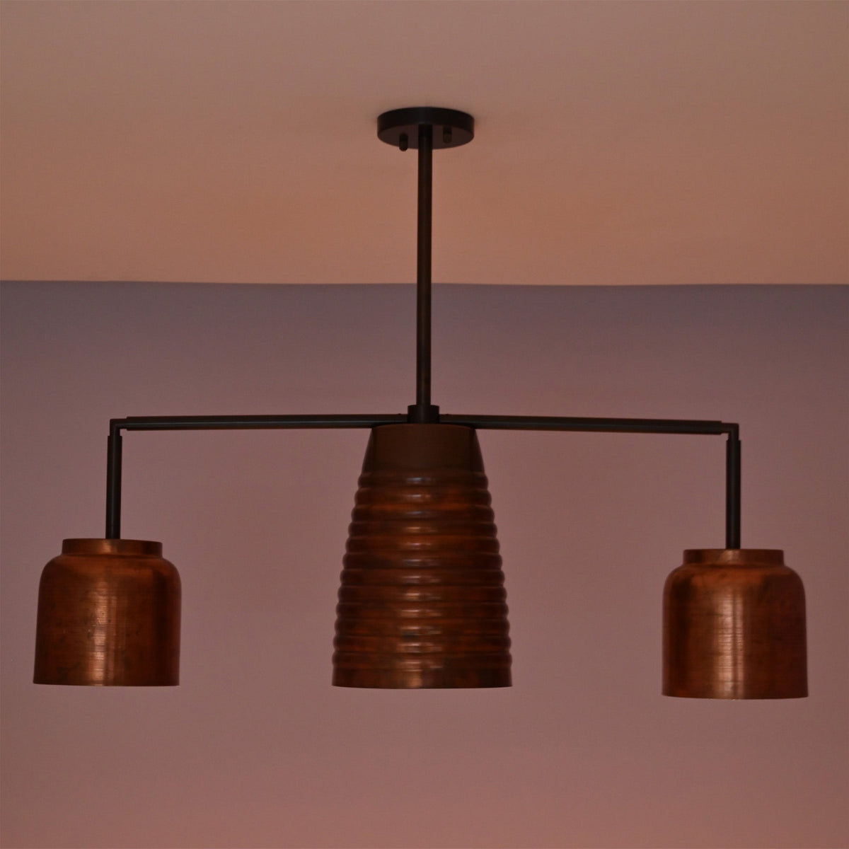 Unlit Hudson Modern Linear Three Shade Chandelier featuring a ribbed center shade, two cylindrical side shades, and a minimalist linear frame.