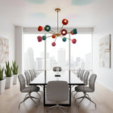 Hudson 12 light Mid-Century Modern Sputnik chandelier shown from the front with colorful rounded shades and brass-tone multi-arm construction.