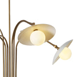 Close-up of a brass chandelier’s frosted glass shade and globe light, showcasing fine metal craftsmanship and warm illumination