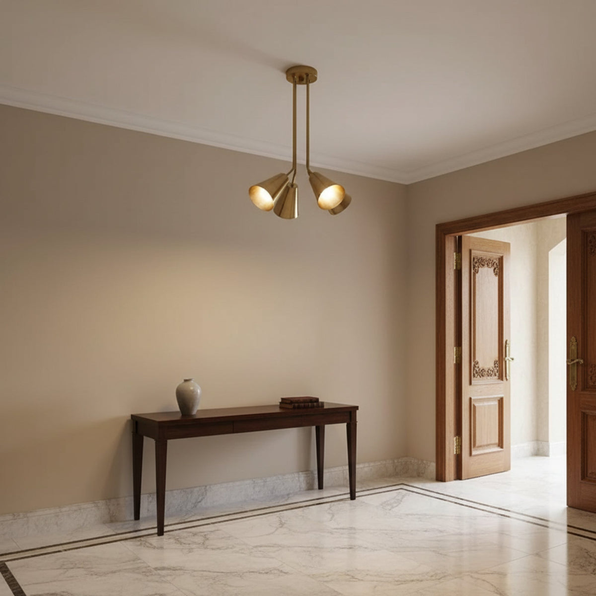 Kensington 4 light aged brass cluster chandelier shown from an angled view with sculptural tapered cone shades.